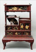 A late 19th/early 20th century Japanese Export ivory inlaid lacquered cabinet Of architectural form,