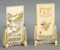 A pair of Chinese reticulated and carved ivory table screens and stands Each panel worked with