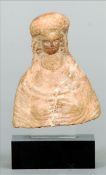 A Roman Hellenistic pottery bust Formed as a woman mounted on a later perspex stand. 7.75 cms