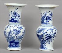 A pair of 19th century Chinese porcelain blue and white vases The flared necks decorated with