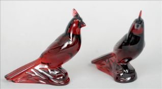 A pair of Baccarat rouge glass models of birds Each naturalistically modelled perched on a rock.