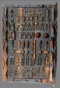 An African carved hardwood door panel With allover geometric decorations. 72 cms wide. Some