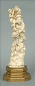 A 19th century carved ivory figural group Formed as a bearded man with two rats and four children,