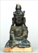 An archaistic style Sino-Tibetan figure of Buddha Modelled in typical form seated in the lotus