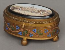 A 19th century Grand Tour micro-mosaic inset gilt bronze trinket box The hinged oval lid inset