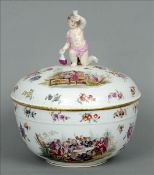 A Berlin porcelain tureen and cover The removable cover surmounted with a putto finial and painted