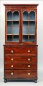 A 19th century mahogany secretaire bookcase The moulded rectangular cornice above twin arched glazed