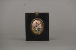 An 18th century enamelled miniature on copper Painted with two figures in a landscape, housed in a