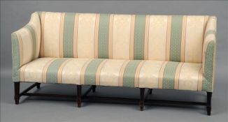 A 19th century upholstered mahogany settee The padded back above twin padded arms and an overstuffed