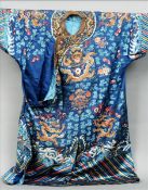 A 19th century Chinese silk kimono Decorated with five clawed dragons chasing flaming pearls amongst