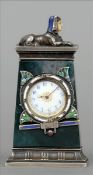 A small Egyptian Revival silver and enamel decorated jade mantel clock The plinth top surmounted