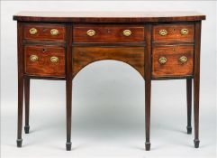 A George III mahogany bow fronted sideboard The line inlaid shaped top above an arrangement of