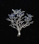 A platinum and sapphire brooch Formed as a blossoming tree set with sapphires. 5 cms high. General