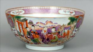 A 19th century Cantonese famille rose punch bowl The interior with a cell diaper border centrally