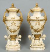 A pair of 19th century white painted and gilt decorated terracotta urns The pineapple finial mounted