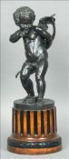 A patinated bronze figure of cupid Typically modelled with a sheath of arrows at his feet,