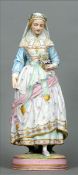 A late 19th century Villeroy and Bosch bisque figure of a religious young lady Modelled standing,