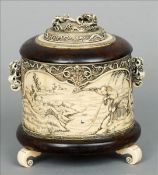 A 19th century Chinese carved ivory tusk section box The domed removable lid carved with a ruyi