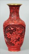 A red cinnabar lacquer vase With allover scrolling decoration, the main body decorated with birds