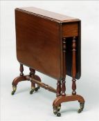 A Victorian mahogany Sutherland table The moulded rectangular twin flap top supported on turned