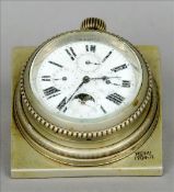 An unusual travelling clock The circular white enamelled dial with Roman numerals with subsidiary