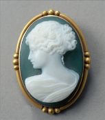 A 14 ct gold mounted hardstone cameo brooch Centred with the bust of a classical maiden. 4.25 cms