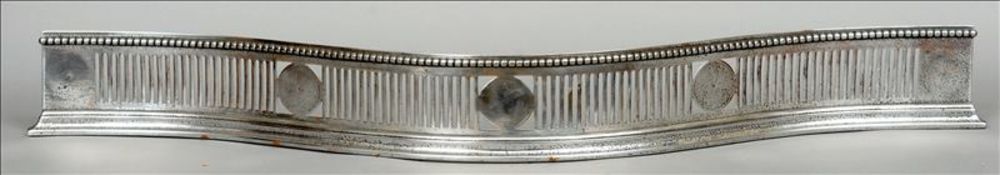 A George III polished steel fender Of pierced serpentine form. 113.5 cms wide. Generally in good