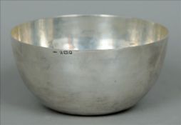 A George VI silver bowl, hallmarked London 1941, maker’s mark of HJB The deep body with beaten