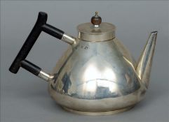 A Victorian silver teapot, in the style of Christopher Dresser, hallmarked Birmingham 1895, maker’