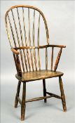 A 19th century elm and beech Windsor chair The curved top rail above central uprights and twin