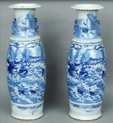 A large pair of 19th century Oriental blue and white vases The flared neck rim with twin pierced