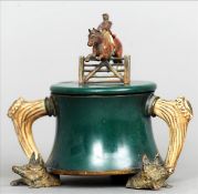 A 19th century cold painted bronze mounted inkwell The hinged lid surmounted with a leaping horse