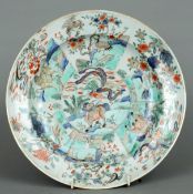 A 19th century Sampson plate Decorated in the Oriental style. 29.5 cms diameter. Some fritting,