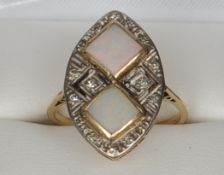 A gold, diamond and opal ring Of navette form with two central square set opals. 2.25 cms high.