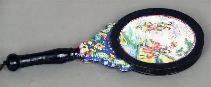 A late 19th/early 20th century Canton enamelled hand mirror The back decorated with figures in a