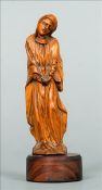 A 17th/18th century carved boxwood figure Modelled as the Virgin Mary, wearing flowing robes, with a