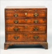 An 18th century walnut caddy top chest of drawers The feather banded moulded rectangular top above a