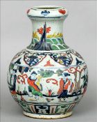 A 19th century Oriental pottery vase The lappet decorated flared neck rim above a band of
