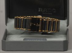 A boxed Rado Dastar gentleman’s wristwatch The rectangular dial with date aperture; together with