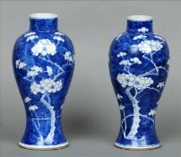 A pair of 19th century Chinese blue and white vases Each of waisted tapering bulbous form, the