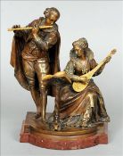 A 19th century patinated bronze figural group Formed as a flute and a mandolin player, mounted on