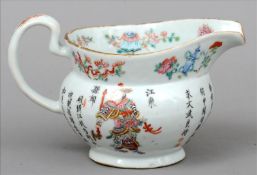 A Chinese porcelain milk jug The exterior decorated with a sage and a warrior in traditional