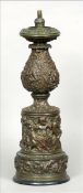 A 19th century patinated bronze lamp base With allover cast decoration depicting various animals