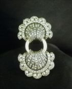 An unmarked white and yellow metal stone set doublet brooch 6.5 cms wide. Some general wear.