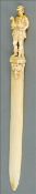 A 19th century Dieppe ivory paper knife The handle carved as a gentleman carrying geese. 27.5 cms