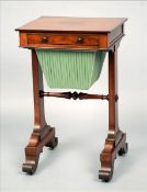 A Victorian mahogany work table The square section top above a frieze drawer and a sliding work box,