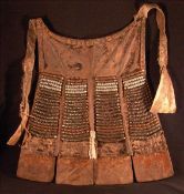 A 19th/20th century African tribal animal hide breast plate Each panel worked with metal beads. 40