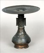 A 19th century Chinese bronze stem vase The extending flattened rim above the cylindrical neck and