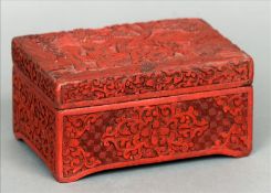 A late 19th/early 20th century cinnabar lacquer box The rectangular removable lid decorated with