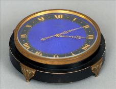 An Art Deco enamelled eight day clock The blue guilloche enamelled dial with gilt Roman numerals and